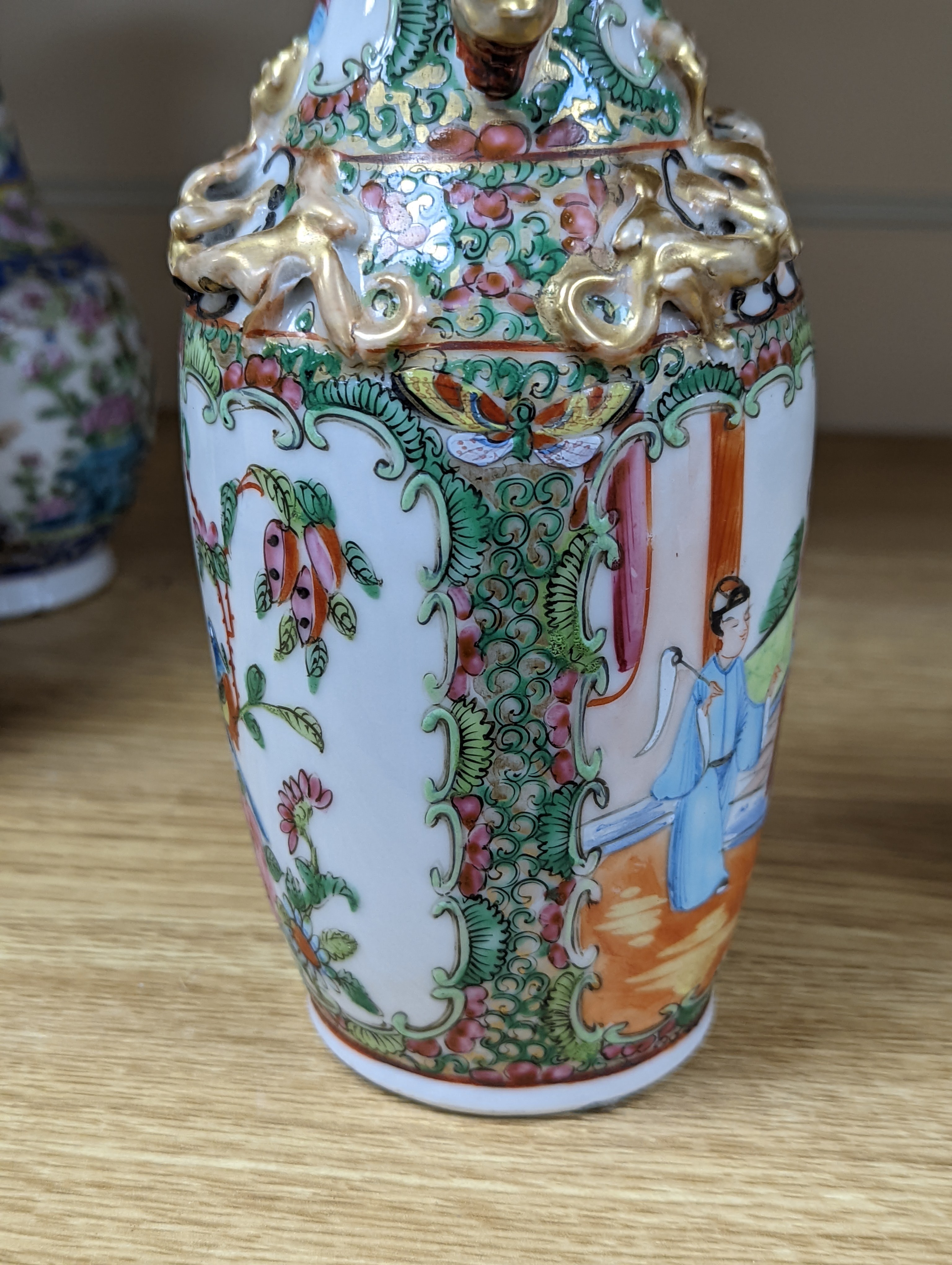 Four 19th century Chinese famille rose vases, 21cm